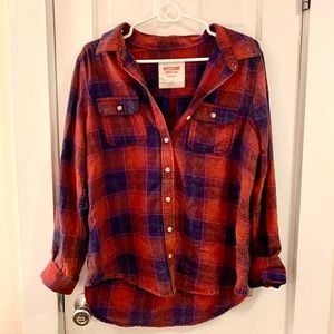 An orange and blue button up flannel